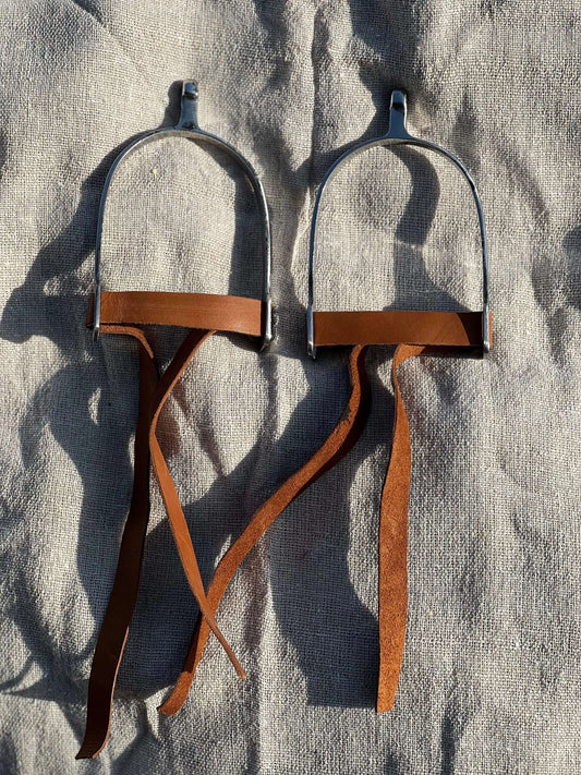 Stainless steel riding spurs with brown leather straps